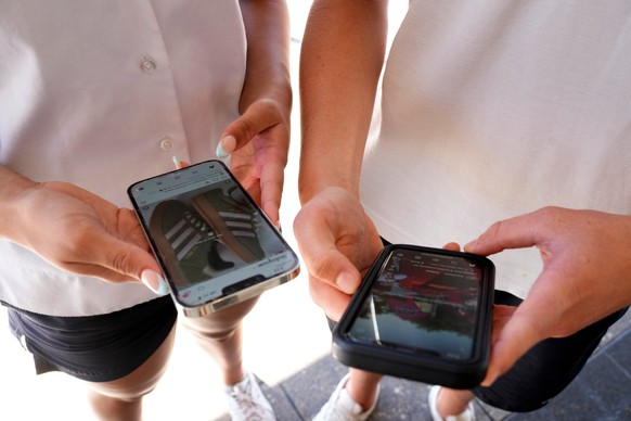 FILE - 14-year-old Henry, right, and Angel, 15, use their phones to view social media in Sydney, on Nov. 8, 2024. (AP Photo/Rick Rycroft, File)
Australia Social Media