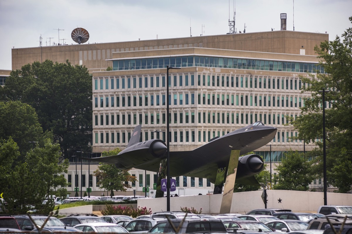 epa04317305 The headquarters of the Central Intelligence Agency (CIA), along with an A-12 supersonic reconnaissance aircraft on display for viewing, is visible from the Agency's north parking lot ...