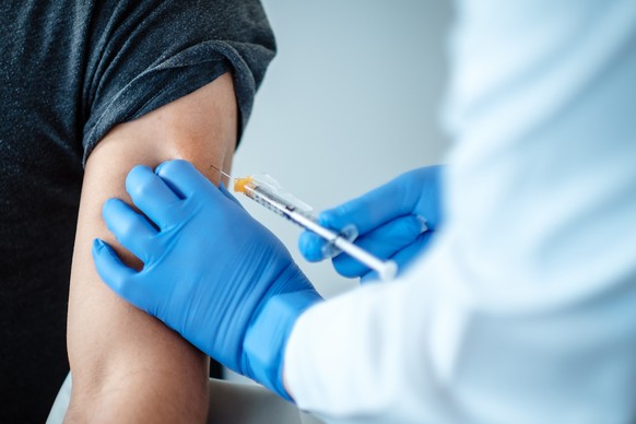 epa08814068 An undated handout picture made available by the German pharmaceutical company Biontec shows the dosing of BNT162b2, the mRNA-based vaccine candidate against COVID-19, during the clinical  ...