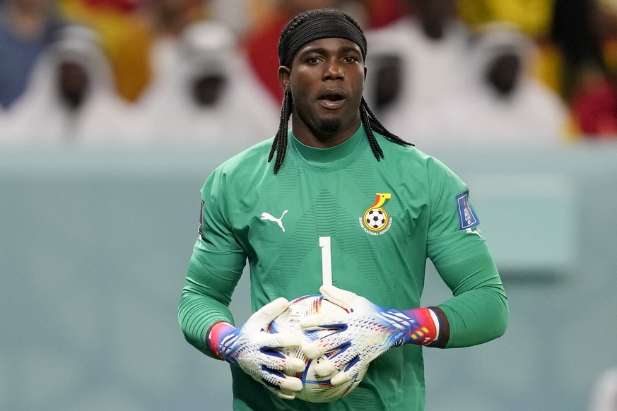 Ghana&#039;s goalkeeper Lawrence Ati-Zigi hold the ball during a World Cup group H soccer match against Uruguay at the Al Janoub Stadium in Al Wakrah, Qatar, Friday, Dec. 2, 2022. (AP Photo/Darko Voji ...