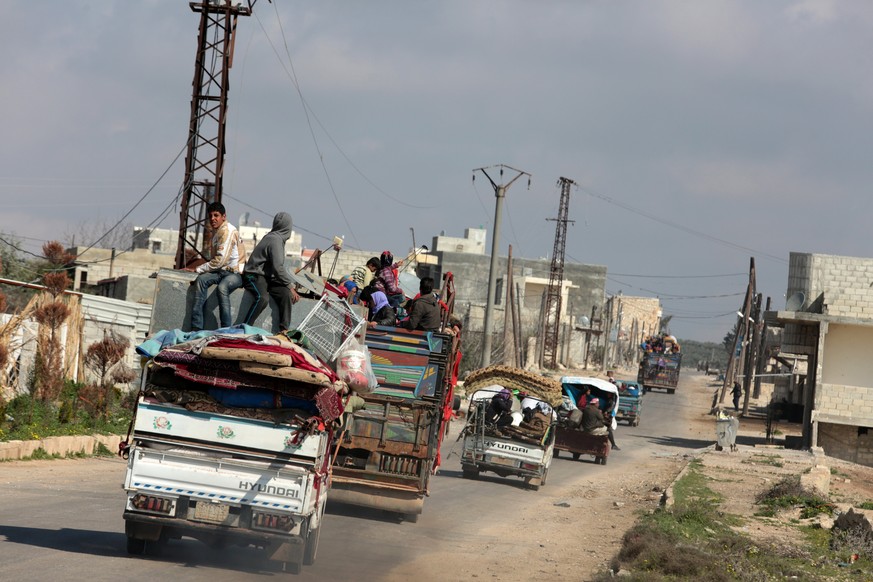 epa06603739 Internally displaced people from various areas under YPG control, arrive to the recently captured by the Free Syrian Army village of Qestel Cindo, Afrin, 14 March 2018. According to media  ...