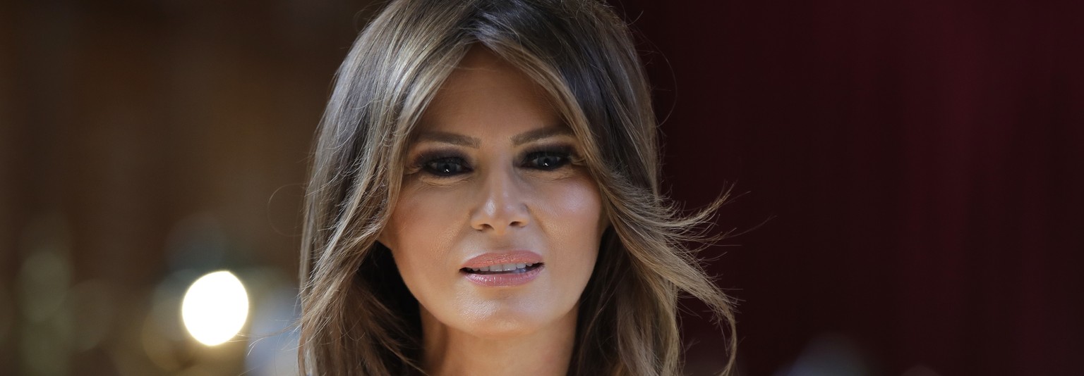 FILE - In a Friday, July 13, 2018 file photo, first lady Melania Trump takes a seat during a visit to The Royal Hospital Chelsea in central London. First lady Melania Trump’s move to distance herself  ...