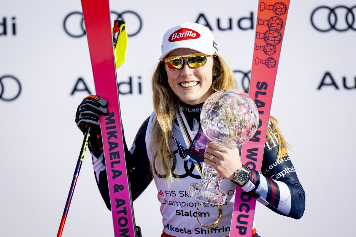Mikaela Shiffrin of the United States, winner of the women's Slalom overall leader crystal globe trophy, celebrates during the podium ceremony at the Lillehammer FIS Alpine Ski World Cup Finals,  ...