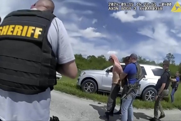 In this image taken from police body camera video and released by the Martin County, Fla., Sheriff?s Office, law enforcement officers arrest Ryan Routh, the man suspected in the apparent assassination ...