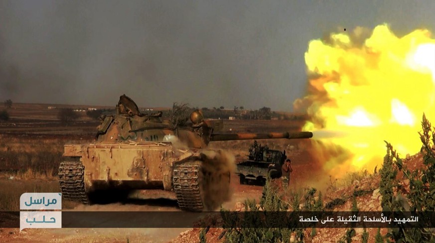 This image posted on the Twitter page of Syria's al-Qaida-linked Nusra Front on Tuesday June 14, 2016, which is consistent with AP reporting, shows a Nusra Front tank firing at Syrian troops and pro-g ...