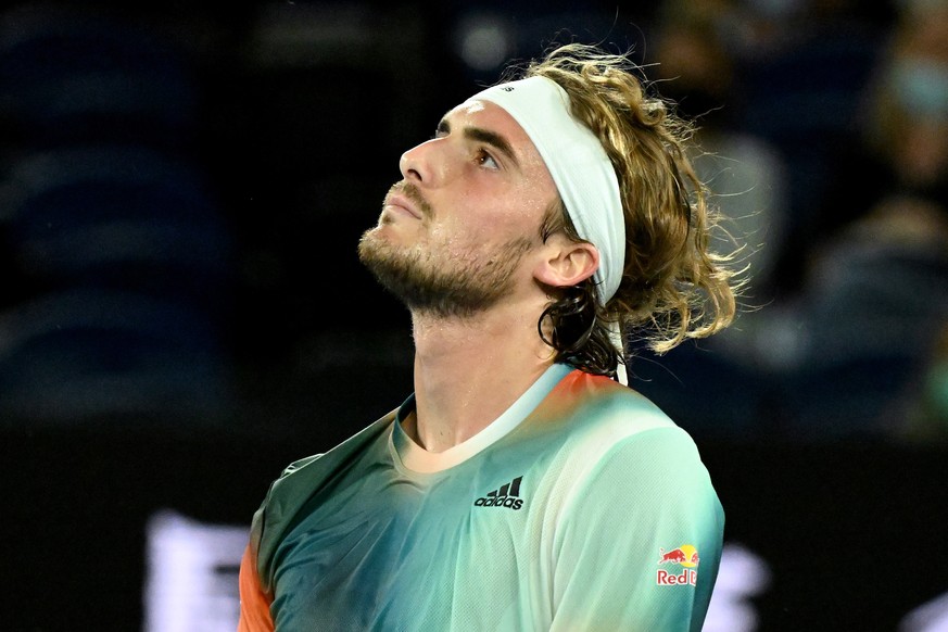 epa09692882 Stefanos Tsitsipas of Greece reacts during his first round Men?s singles match against Mikael Ymer of Sweden on Day 2 of the Australian Open, at Melbourne Park in Melbourne, Australia, 18  ...