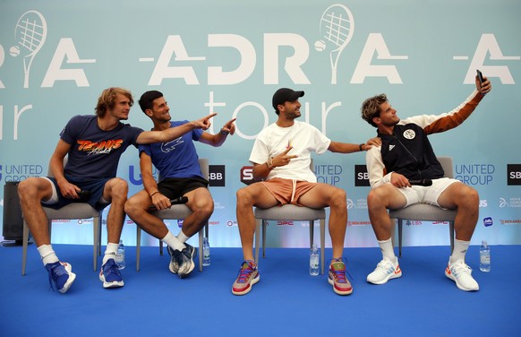 200614 -- BEIJING, June 14, 2020 -- Alexander Zverev of Germany, Novak Djokovic of Serbia, Grigor Dimitrov of Bulgaria and Dominic Thiem of Austria from L to R pose for a selfie during the press confe ...