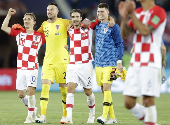 Croatia&#039;s Luka Modric, left, with teammates celebrate after winning the group D match between Croatia and Nigeria at the 2018 soccer World Cup in the Kaliningrad Stadium in Kaliningrad, Russia, S ...