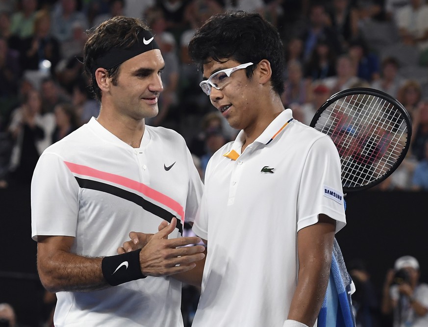 Switzerland&#039;s Roger Federer, left, is congratulated by South Korea&#039;s Hyeon Chung after Chung retired injured from their semifinal at the Australian Open tennis championships in Melbourne, Au ...