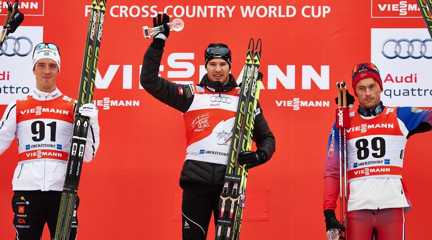 Dario Cologna siegt vor dem Schweden Calle Halfvarsson (links) und dem Norweger Petter Northug.