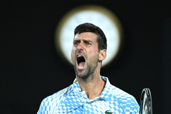 epa10428190 Novak Djokovic of Serbia celebrates a point during his quarterfinal match against Andrey Rublev of Russia at the 2023 Australian Open tennis tournament in Melbourne, Australia, 25 January  ...