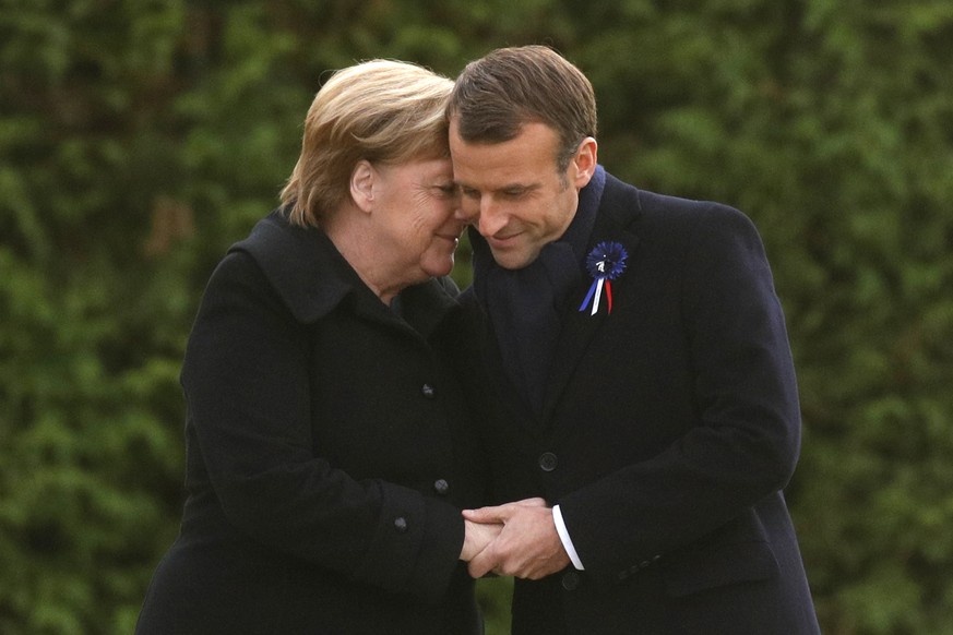 French President Emmanuel Macron and German Chancellor Angela Merkel are head to head after unveiling a plaque in the Clairiere of Rethondes during a commemoration ceremony for Armistice Day, 100 year ...