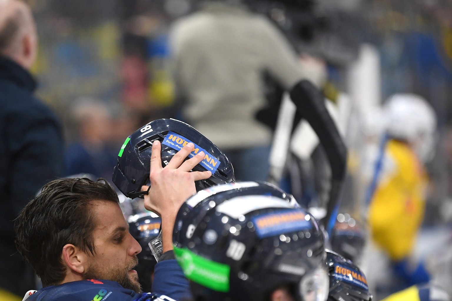 Ambri&#039;s player Thomas Ruefenacht takes of his helmet during the preliminary round game of National League Swiss Championship 2022/23 between, HC Ambri Piotta against HC Davos at the Gottardo Aren ...