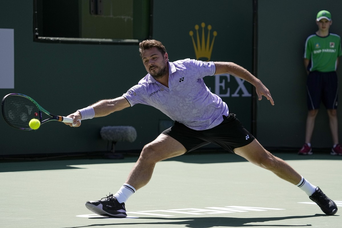 Stan Wawrinka, of Switzerland, serves to Holger Rune, of Denmark, at the BNP Paribas Open tennis tournament Monday, March 13, 2023, in Indian Wells, Calif. (AP Photo/Mark J. Terrill)