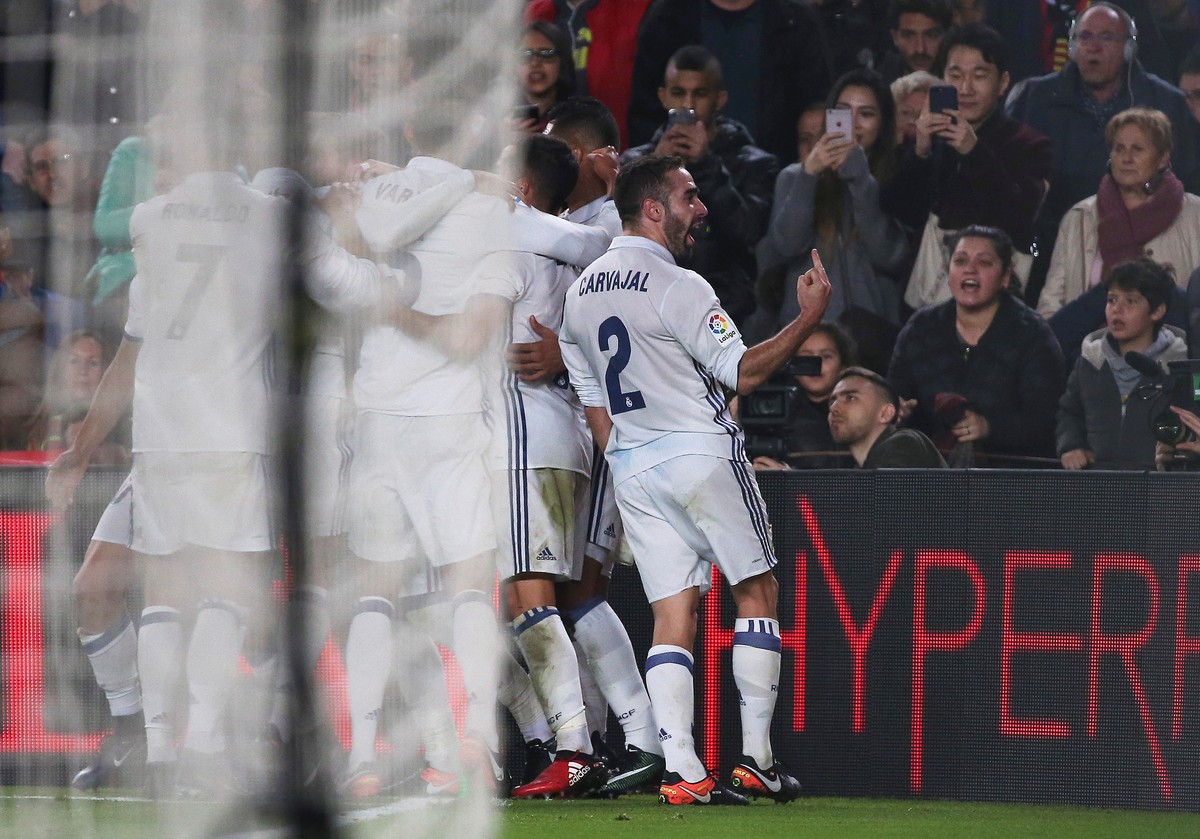 Football Soccer - Barcelona v Real Madrid - Spanish La Liga Santander- Nou Camp Stadium, Barcelona, Spain - 3/12/16. Real Madrid's Daniel Carvajal gestures while celebrating a goal by team-mate S ...