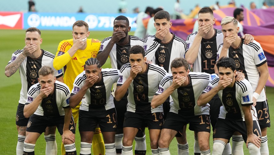 German&#039;s team covers their mouth during the team photo prior to the World Cup group E soccer match between Germany and Japan, at the Khalifa International Stadium in Doha, Qatar, Wednesday, Nov.  ...