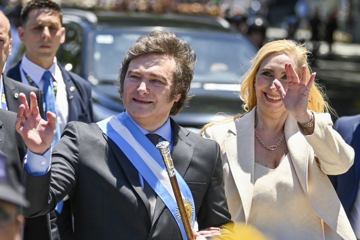 Accompanied by his sister Karina, Argentina's newly sworn-in President Javier Milei arrives to the government house in Buenos Aires, Argentina, Sunday, Dec. 10, 2023. (AP Photo/Julian Bongiovanni ...