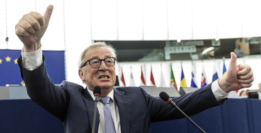 European Commission President Jean-Claude Junker clowns around with photographers following a 30mm-delay due to a strike of the translators before a plenary session of the European Parliament, in Stra ...