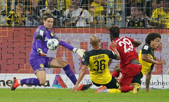 epa07755347 Dortmund&#039;s goalkeeper Marwin Hitz (L) in action during the German Supercup soccer match between Borussia Dortmund and Bayern Munich in Dortmund, Germany, 03 August 2019. EPA/RONALD WI ...