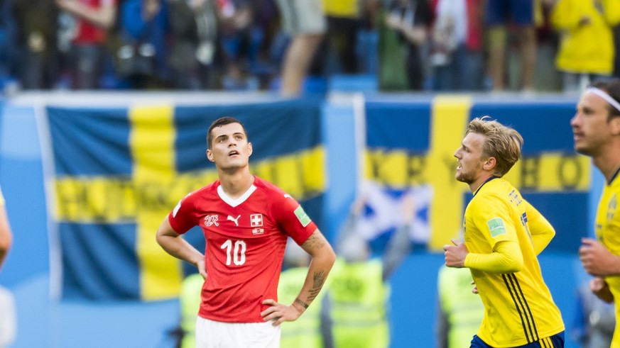 Switzerland&#039;s midfielder Granit Xhaka, center, reacts during the FIFA World Cup 2018 round of 16 soccer match between Sweden and Switzerland at the Krestovski Stadium, in St. Petersburg, Russia,  ...