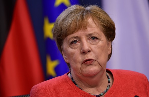 epa08557760 German Chancellor Angela Merkel speaks during a joint video press conference with French President Emmanuel Macron at the end of the European Council in Brussels, Belgium, 21 July 2020. Eu ...