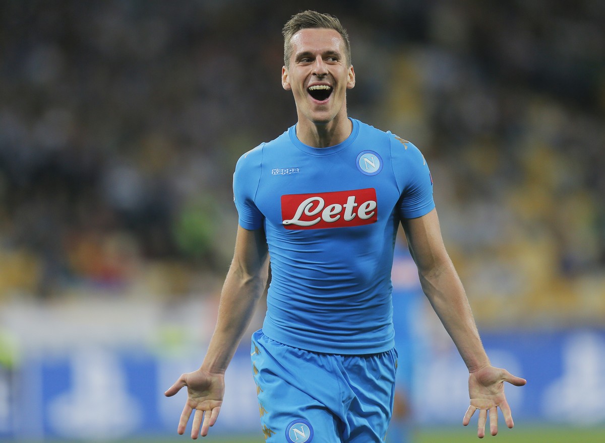 Napolis Arkadiusz Milik celebrates after scoring his second goal over Dynamo Kiev's Domagoj Vida during the Champions League Group B soccer match between Dynamo Kiev and Napoli at the Olympiyski ...