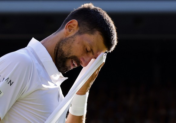 epa12232375 Novak Djokovic of Serbia reacts during the Men&#039;s Singles semi-finals match against Jannik Sinner of Italy at the Wimbledon Championships, Wimbledon, Britain, 11 July 2025. EPA/TOLGA A ...