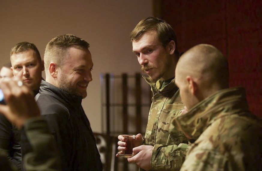 FILE - Ukrainian Interior Minister Denys Monastyrsky, second left, talks with Azov regiment commander Denys Prokopenko, second right, who was released in a prisoner exchange between Russia and Ukraine ...