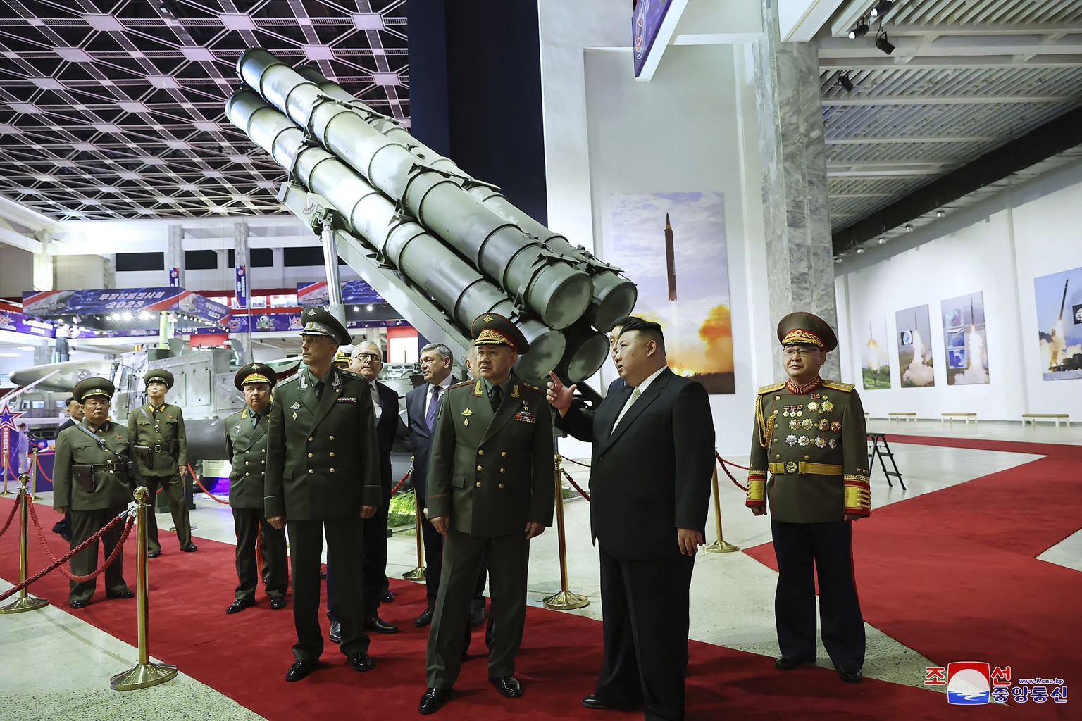FILE - In this photo provided by the North Korean government, North Korean leader Kim Jong Un, second right, and Russian Defense Minister Sergei Shoigu, third right, visit an arms exhibition in Pyongy ...