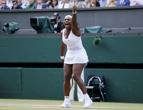 Serena Williams of the U.S.A. reacts after breaking serve during her match against Victoria Azarenka of Belarus at the Wimbledon Tennis Championships in London, July 7, 2015. REUTERS/Stefan Wermuth