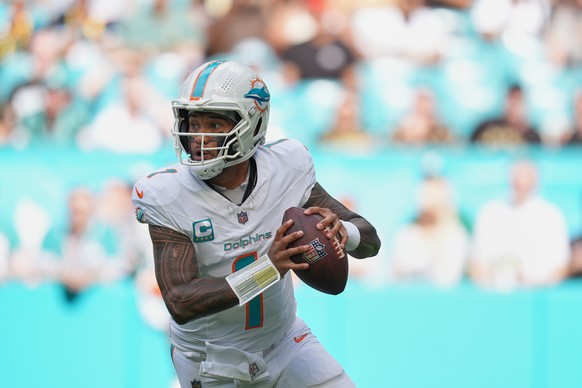 Miami Dolphins quarterback Tua Tagovailoa (1) aims a pass during the first half of an NFL football game against the New Orleans Saints Sunday, Nov. 30, 2025, in Miami Gardens, Fla. (AP Photo/Rebecca B ...