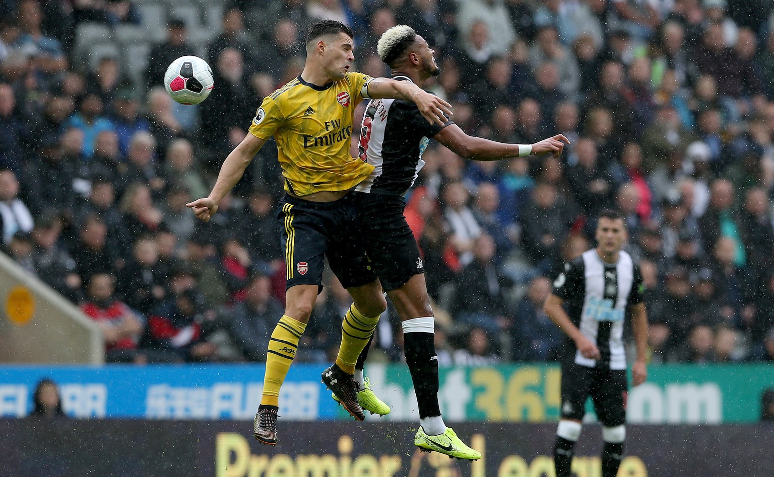 epa07768256 Newcastle United&#039;s Joelinton (R) in action with Arsenal&#039;s Granit Xhaka during the English Premier League soccer match between Newcastle United and Arsenal at St James Park Stadiu ...