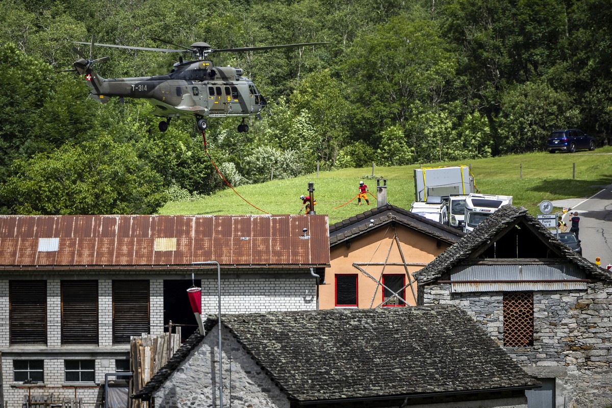 A Swiss army helicopter lands in Prato Sornico, Lavizzara in the Maggia Valley, southern Switzerland on Wednesday July 3, 2024. Severe storms and torrential rain over the last weekend left five people ...