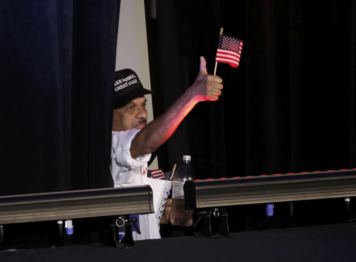 A Trump supporter gives a thumbs-up at Republican U.S. presidential nominee Donald Trump's election night rally in Manhattan, New York, U.S., November 8, 2016. REUTERS/Mike Segar