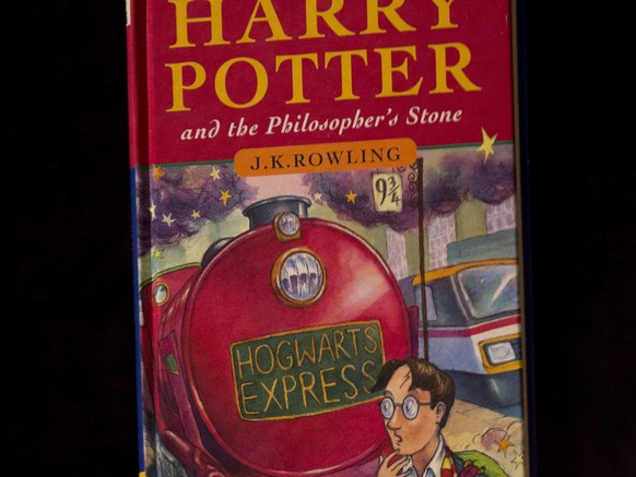 FILE - This May 20, 2013, file photo shows a first edition copy of the first Harry Potter book &quot;Harry Potter and the Philosopher&#039;s Stone&quot; during a photocall organized for the media at t ...