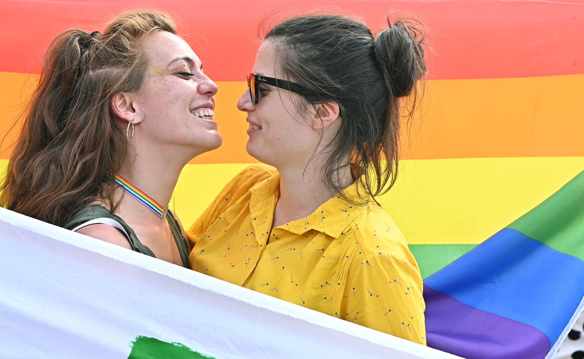 epa09249988 Two women embrace as they rally during the pride parades in Turin, Italy, 05 June 2021. The rally is also to support the Zan law, a bill drafted by Alessandro Zan, a gay politician with th ...