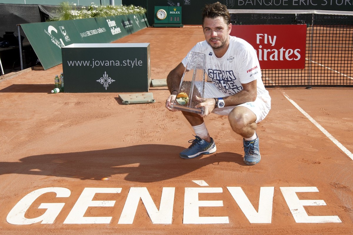 Stanislas "Stan" Wawrinka, of Switzerland, poses with the trophy after beating Mischa Zverev, of Germany, at the final match of the Geneva Open tournament, in Geneva, Switzerland, Saturday,  ...