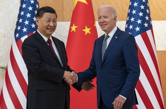 FILE - U.S. President Joe Biden, right, and Chinese President Xi Jinping shake hands before a meeting on the sidelines of the G20 summit meeting in Bali, Indonesia Nov. 14, 2022. Leaders of the Group  ...