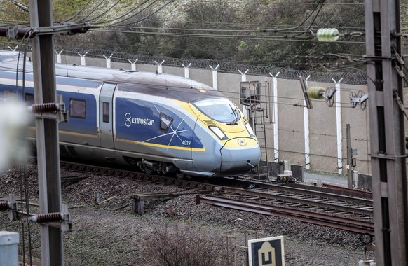 epa11029684 A Eurostar high-speed train drives in the Eurotunnel in Coquelles, northern France, 14 December 2023. For 30 years, the Eurotunnel has been connecting the 50 kilometers that separate the U ...