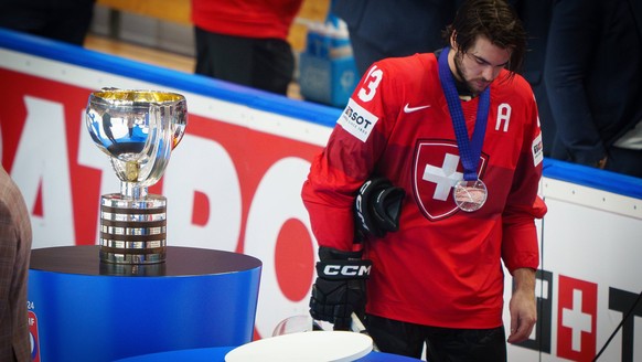 Nico Hirschier Nr. 13 of Switzerland sad beside the trophy after the Gold Medal game CZECHIA - SWITZERLAND 2-0 of the IIHF Ice hockey, Eishockey World Championship, WM, Weltmeisterschaft in Prague, Cz ...