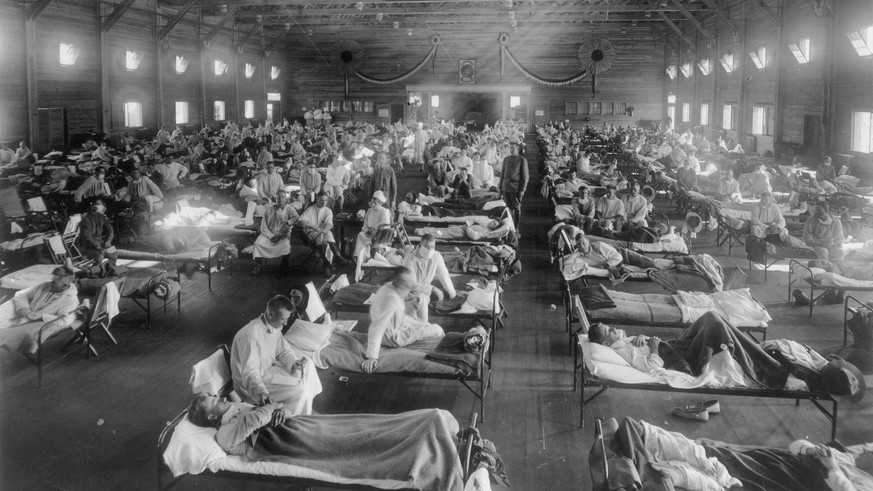 Camp Funston CAMP FUNSTON, KANSAS, USA -- circa 1918 -- Patients in an emergency hospital during 1918-1920 influenza epidemic, Camp Funston, Kansas, USA. The Spanish Flu - as it commonly became known  ...