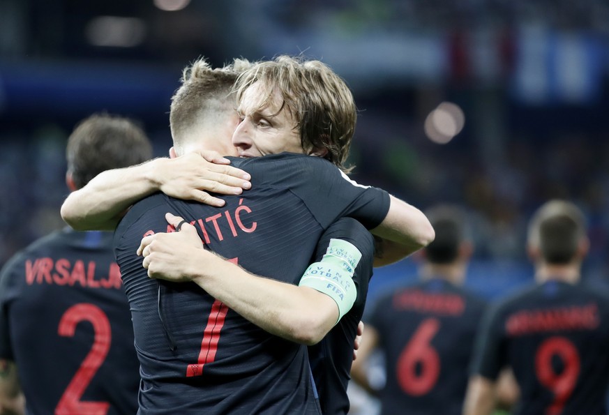 epa06829149 Ivan Rakitic (L) of Croatia celebrates with teammate Luka Modric after scoring the 3-0 lead during the FIFA World Cup 2018 group D preliminary round soccer match between Argentina and Croa ...