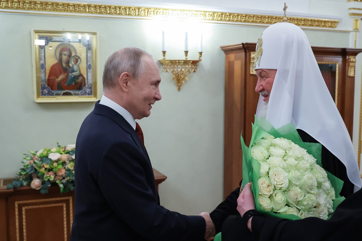 Russian President Vladimir Putin, left, congratulates Russian Orthodox Church Patriarch Kirill on the 17th anniversary of his enthronement at the Patriarchal Chambers of the Moscow's Kremlin, on  ...
