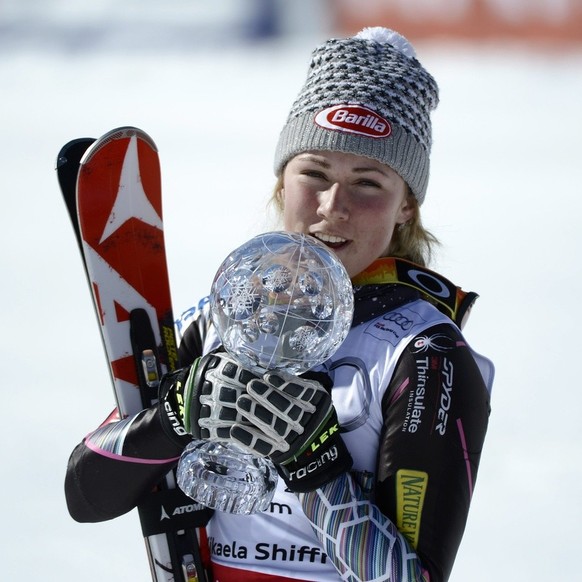 Mikaela Shiffrin of th USA holds the crystal globe as the winner of the overall Slalom Ladies&#039; World Cup after the Ladies&#039; World Cup Slalom at the Alpine Ski World Cup finals in Parpan - Len ...