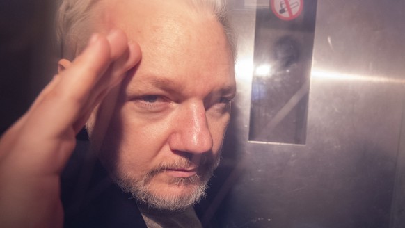 epa07622698 (FILE) - Wikileaks co-founder Julian Assange, in a prison van, as he leaves Southwark Crown Court in London, Britain, 01 May 2019 (reissued 03 June 2019). Reports on 03 June 2019 state Upp ...