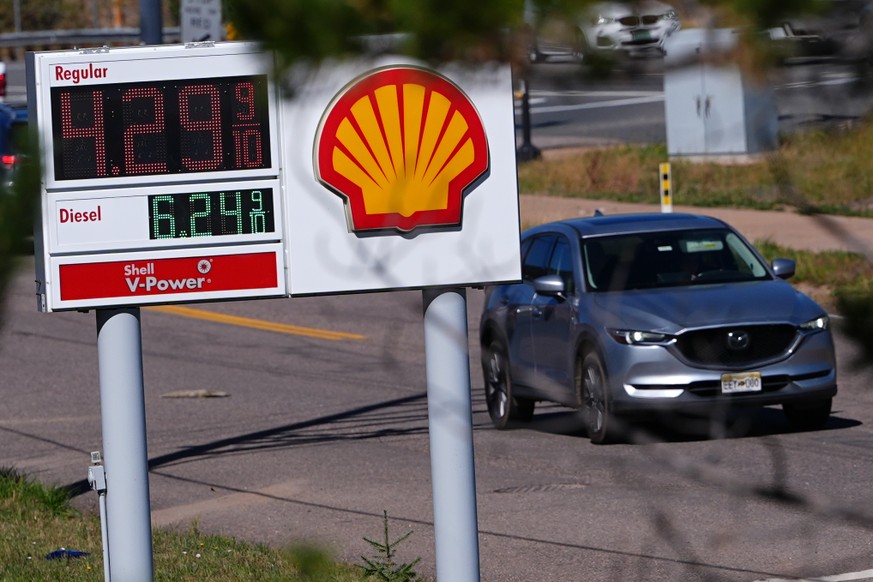 A motorist drives past a sign posting the per-gallon prices for regular unleaded and diesel fuel at a Shell gasoline station Monday, Oct. 5, 2026, in Evergreen, Colo. (AP Photo/David Zalubowski)
Gasol ...