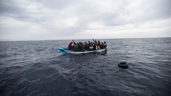 A wooden boat with 28 refugees from Africa and Magreb is rescued by Open Arms NGO, some 45 nautical miles away from the Libyan coast in the Mediterranean Sea, Saturday, March 5, 2022. Due to conflicts ...
