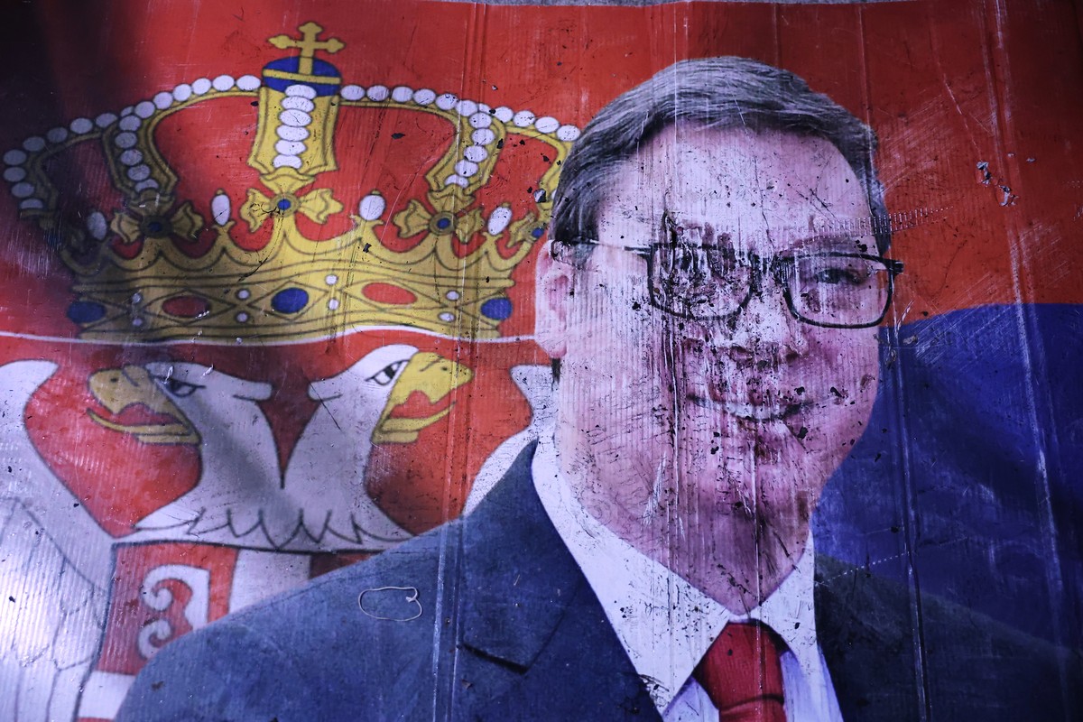 KEYPIX - A defaced poster of Aleksandar Vucic, leader of the right-wing Serbian Progressive Party (SNS), lies on the pavement outside the National Assembly, after he conceded defeat in the parliamenta ...