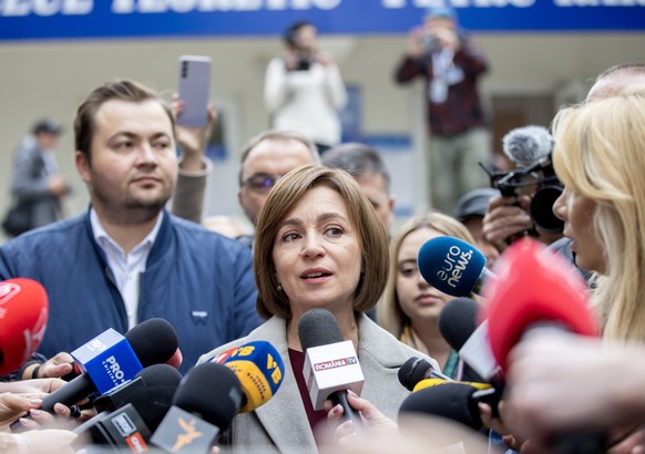epa11670771 President of Moldova Maia Sandu speaks to media after voting in front of polling station in Chisinau, Moldova, 20 October 2024. Moldova holds presidential election and a referendum on whet ...