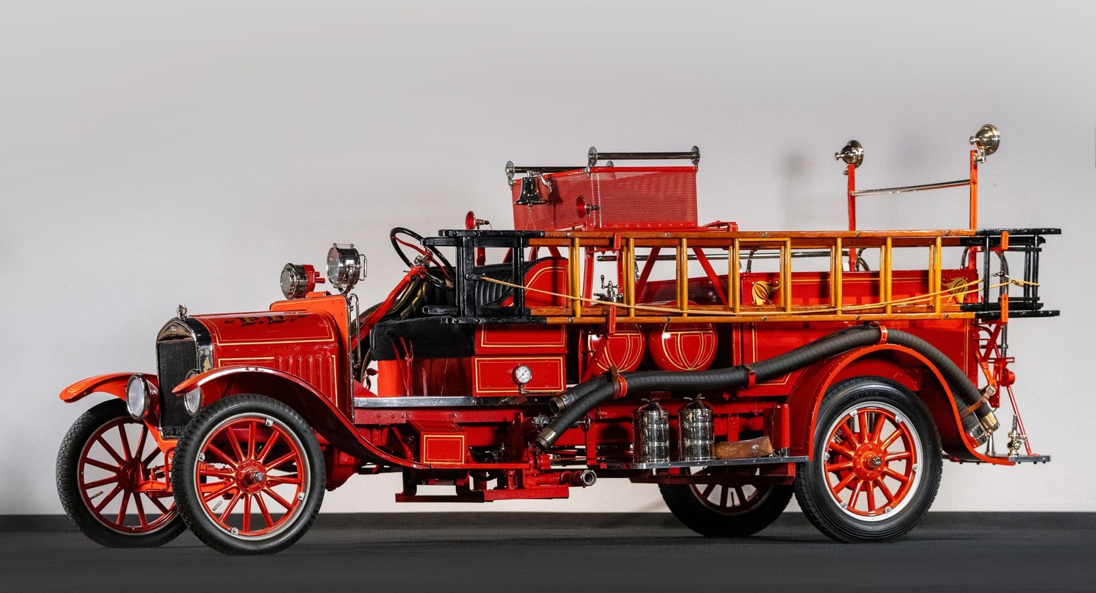 1926 Ford Model TT Triple Combination Fire Truck
176.7ci L-Head Inline Four-Cylinder
Single Sidedraft Carburetor
22bhp at 1,600rpm
Two-Speed Planetary Transmission
Live Axles with Transverse Leaf Spri ...